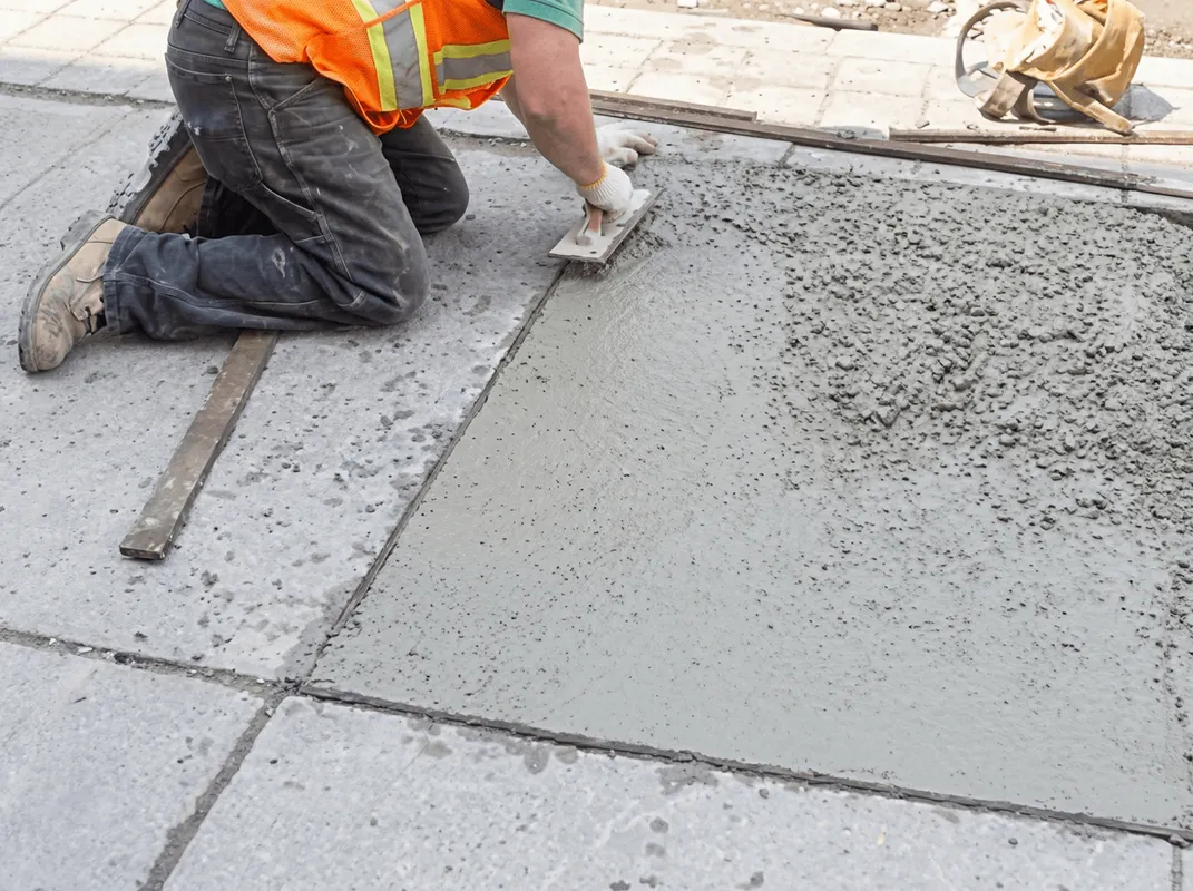 Professional repairing a concrete floor in Memphis, TN